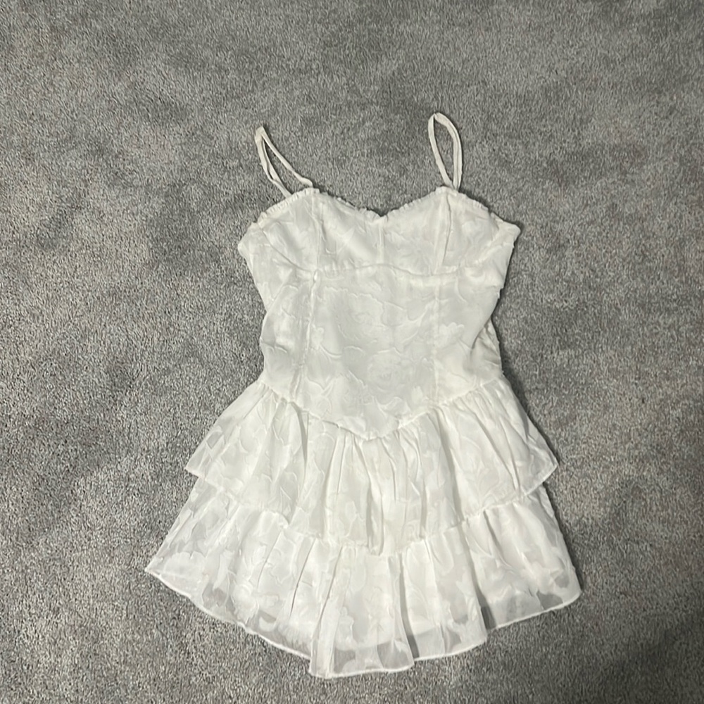 A white ruffle dress with flower prints